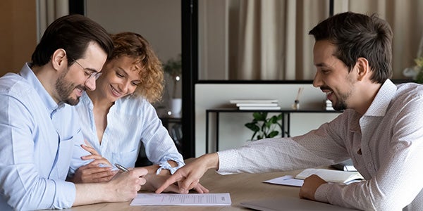 Couple meeting with advisor to review finances